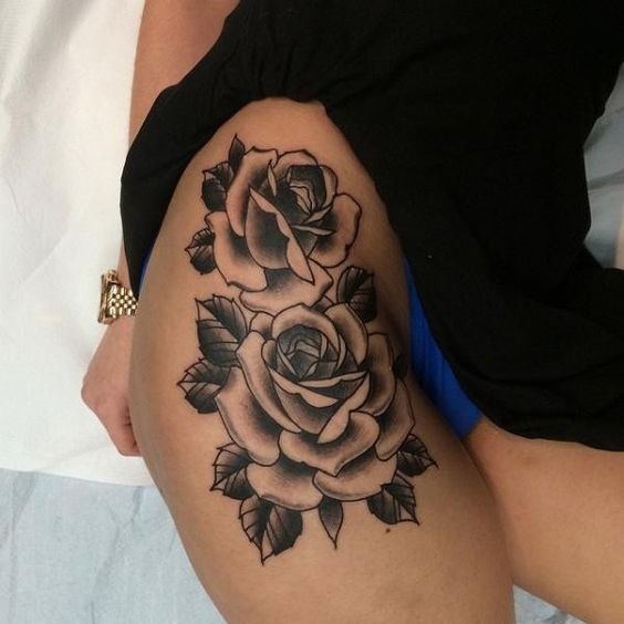 Rose tattoo on the right hip and thigh