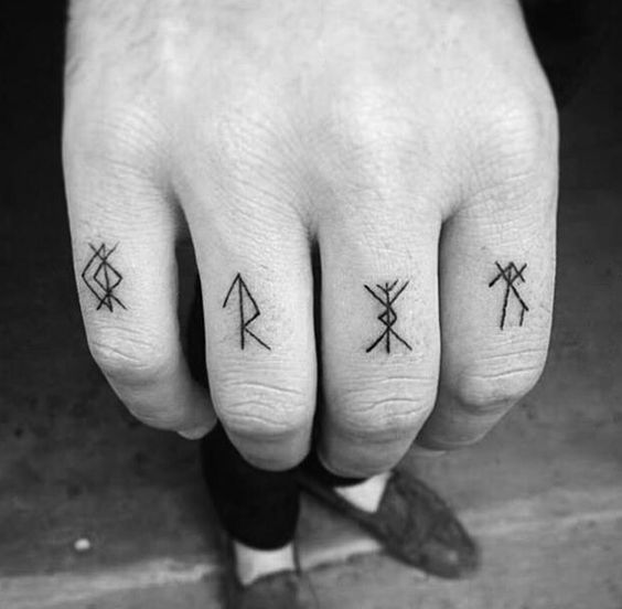 Rune tattoos on right hand's fingers