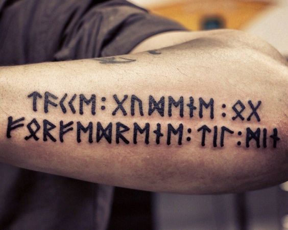 Runic tattoo on the left forearm