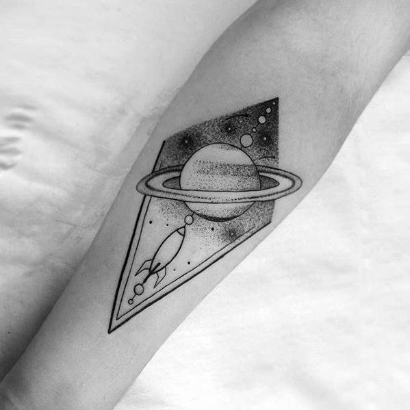 Saturn and spaceship tattoo on the inner arm