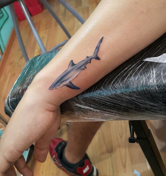 Shark tattoo on the left wrist