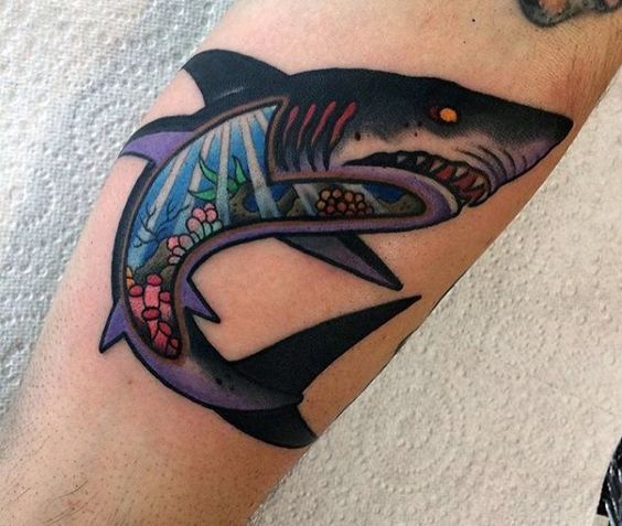 Shark with ocean landscape tattoo on the arm