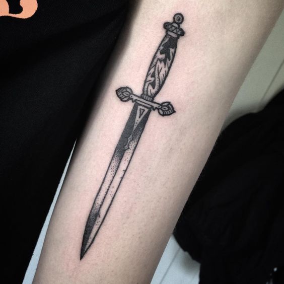 Short dagger tattoo on the left arm