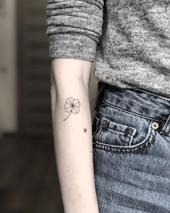 Simple black four leaf clover tattoo by mary tereshchenko
