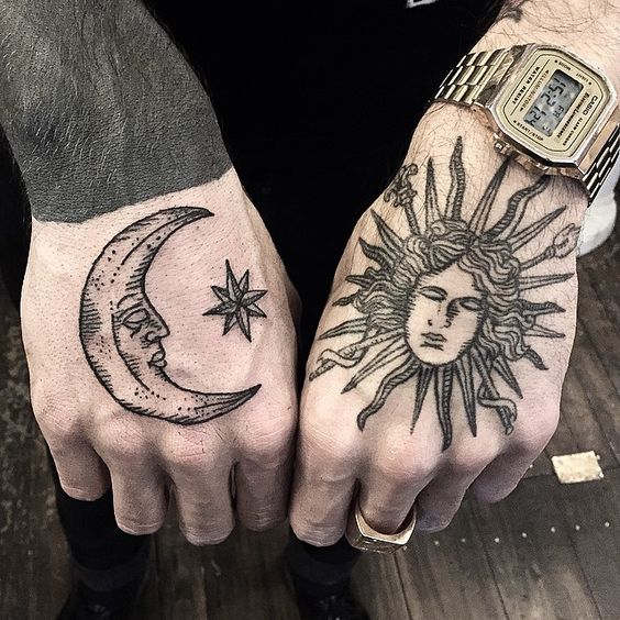 Sleeping sun and moon tattoos on both hands by sue jeiven