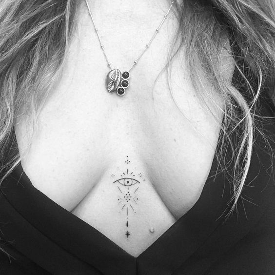 Small abstract sternum tattoo