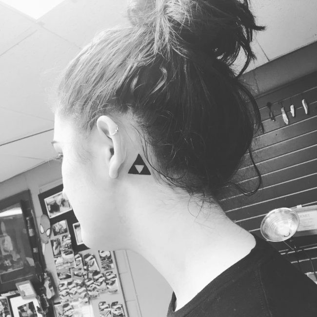 Small black triforce behind the ear tattoo
