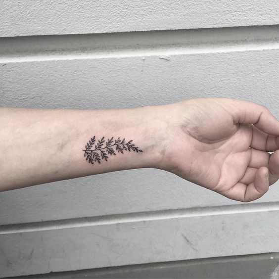 Small fern tattoo on the left wrist