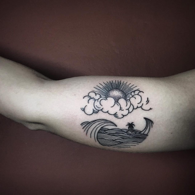 Small island tattoo between the ocean waves