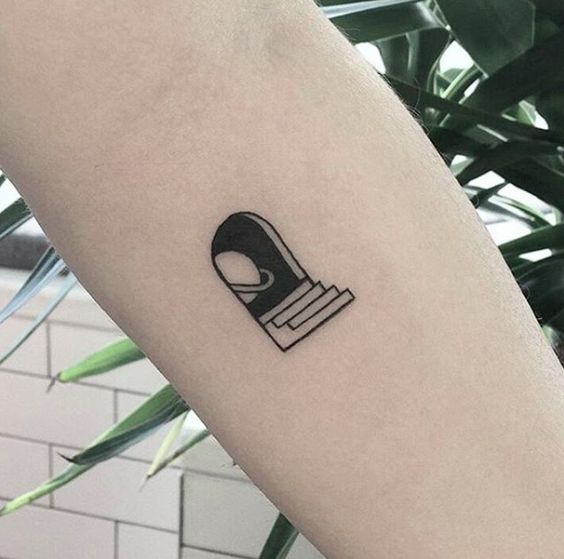 Small saturn and stairs tattoo