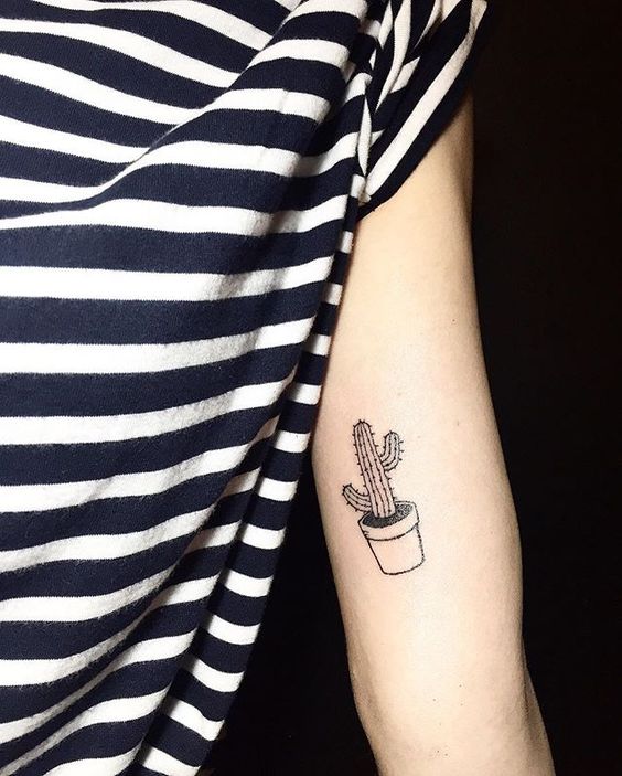 Small tattoo of a black cactus in a pot