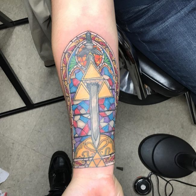 Stained glass triforce and master sword tattoo