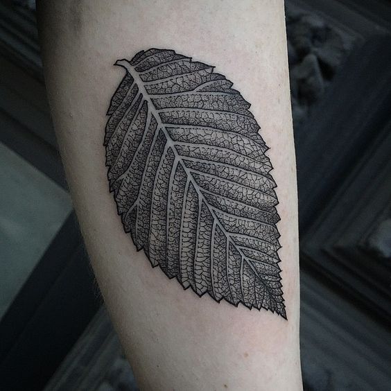 Super detailed black leaf tattoo by susanne suflanda könig