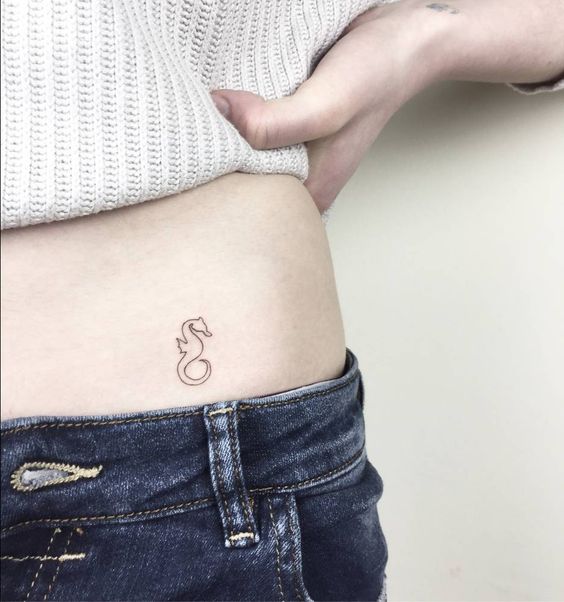 Super small outline seahorse tattoo on the left hipjpg