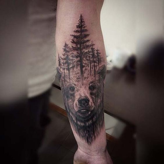 Super tattoo design of a realistic bear and trees above