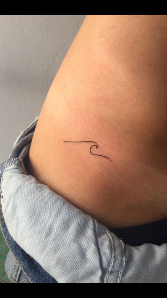 Super tiny wave tattoo on the hip