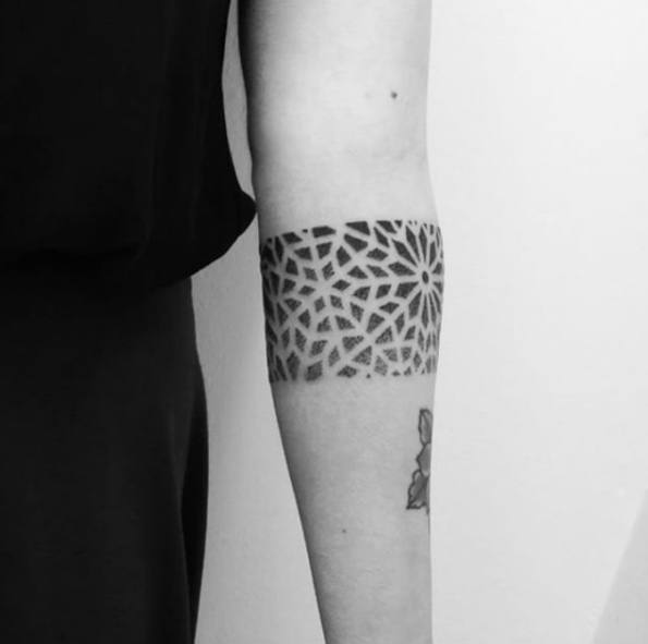 Tattoo of a geometric snowflake armband by martynas snioka