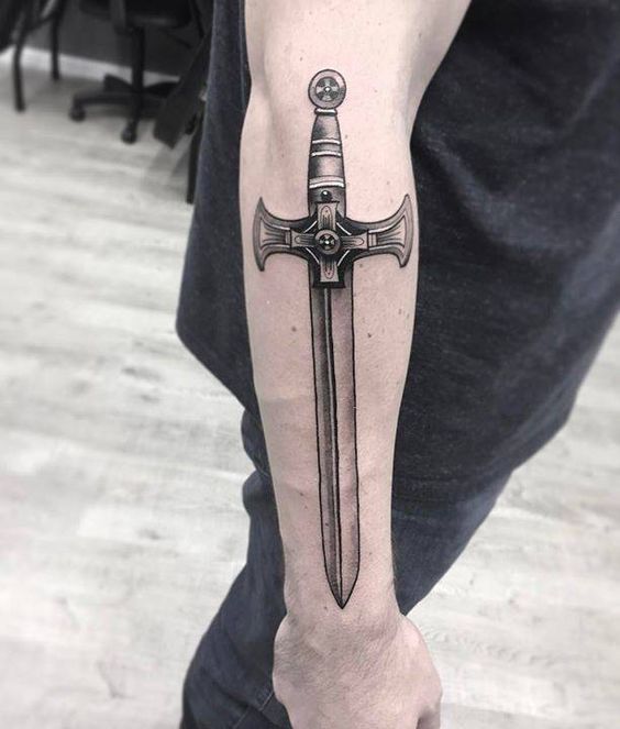 Templar sword tattoo on the right arm