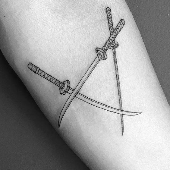 Three katanas tattoo on the arm