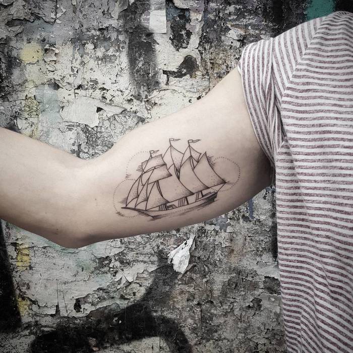 Three masted barque sailing vessel tattoo on the right bicep