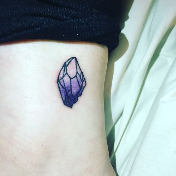 Tiny amethyst tattoo on the ankle