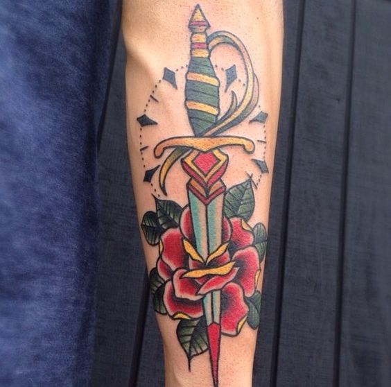 Traditional dagger tattoo with a rose by kyle mackenzie