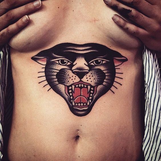 Traditional panther tattoo on the sternum