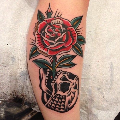 Traditional rose and skull tattoo