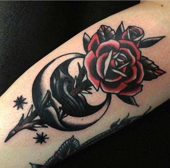 Traditional rose and stabbed moon tattoo by joe ellis