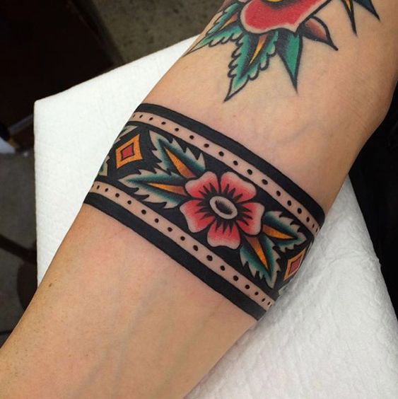 Traditional stylized flower armband tattoo