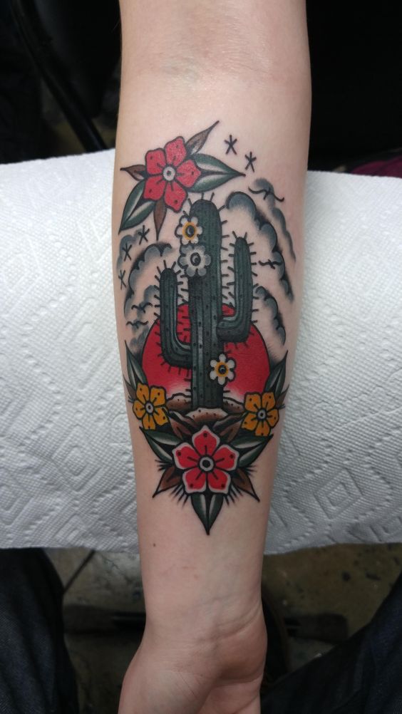 Traditional tattoo of a saguaro cactus on the right forearm
