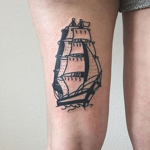 Two masted sailing ship black tattoo on the right upper thigh