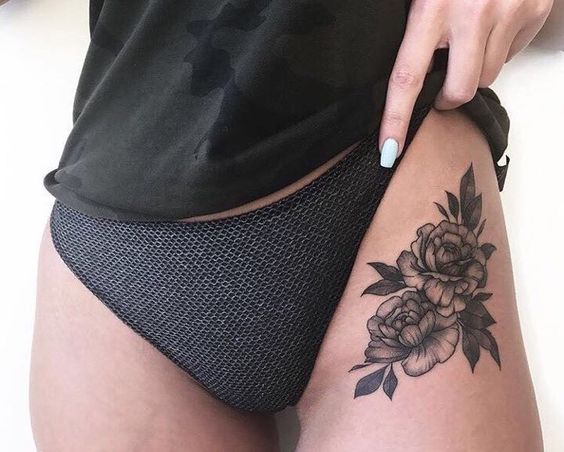Very sexy black rose tattoo on the left hip