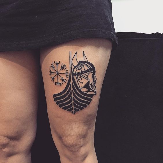 Viking head ship and vegvisir tattoo on the left thigh