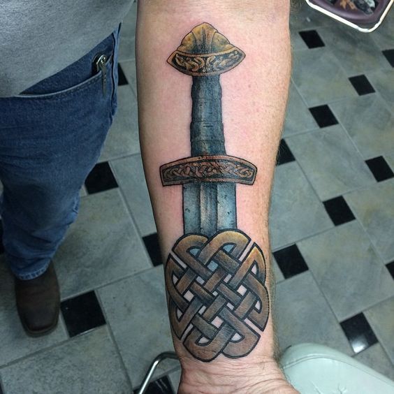 Viking sword tattoo on the left inner arm
