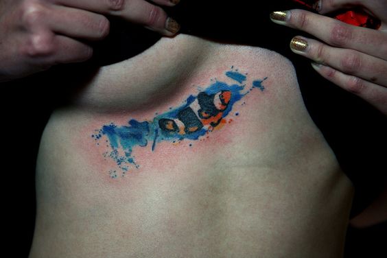 Watercolor Clownfish tattoo in the water