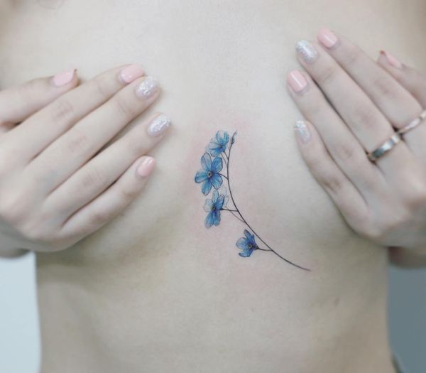 Watercolor blue flowers on the sternum