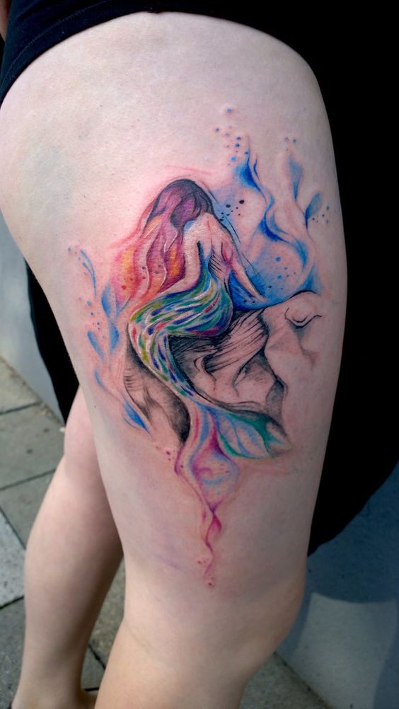 Watercolor mermaid tattoo on the right thigh