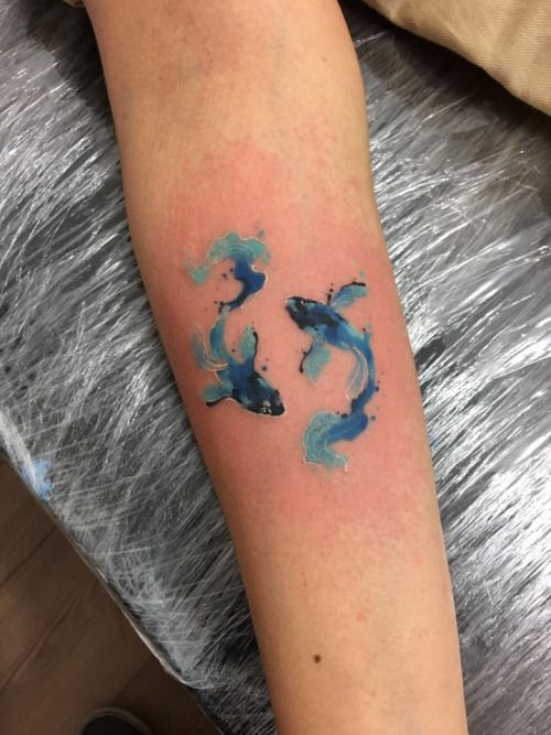 Watercolor tattoo of a two Koi Fish