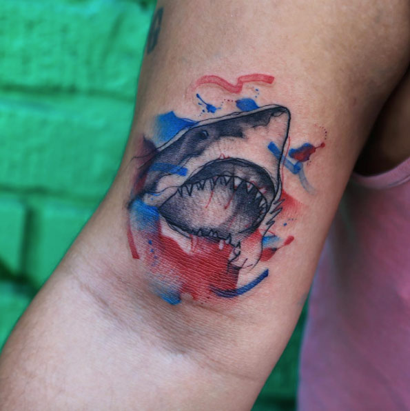 Watercolor wrist tattoo of a shark jaws