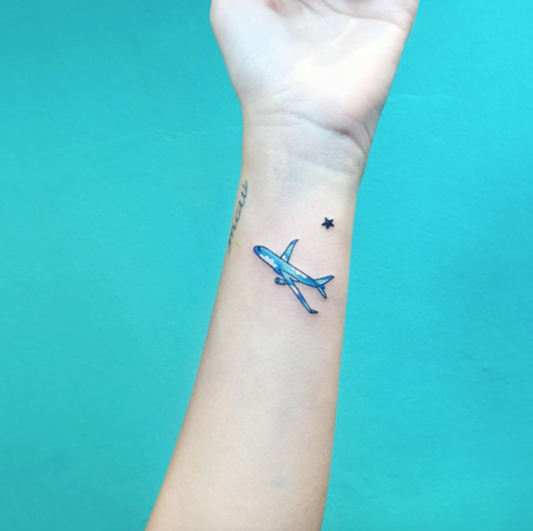 Aircraft filled with cloud background tattoo