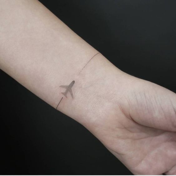 Airplane bracelet tattoo