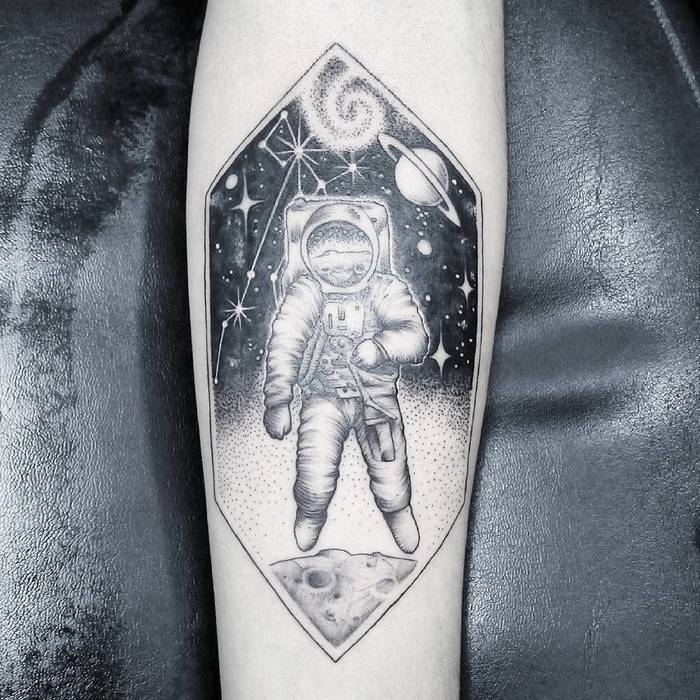 Astronaut floating in space tattoo