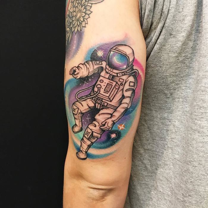 Astronaut in the galactic background tattoo