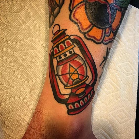 Baby lantern tattoo on the ankle