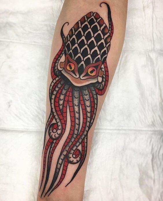Big squid tattoo on the arm