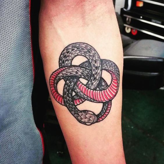 Black and red ouroboros tattoo