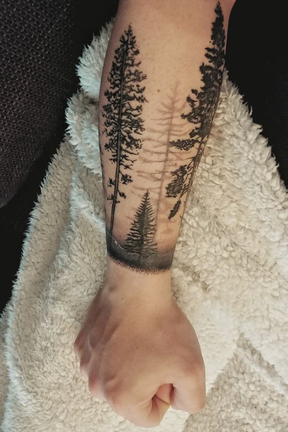 Black forest tattoo on the forearm