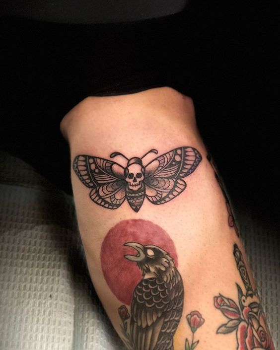 Black traditional death moth tattoo