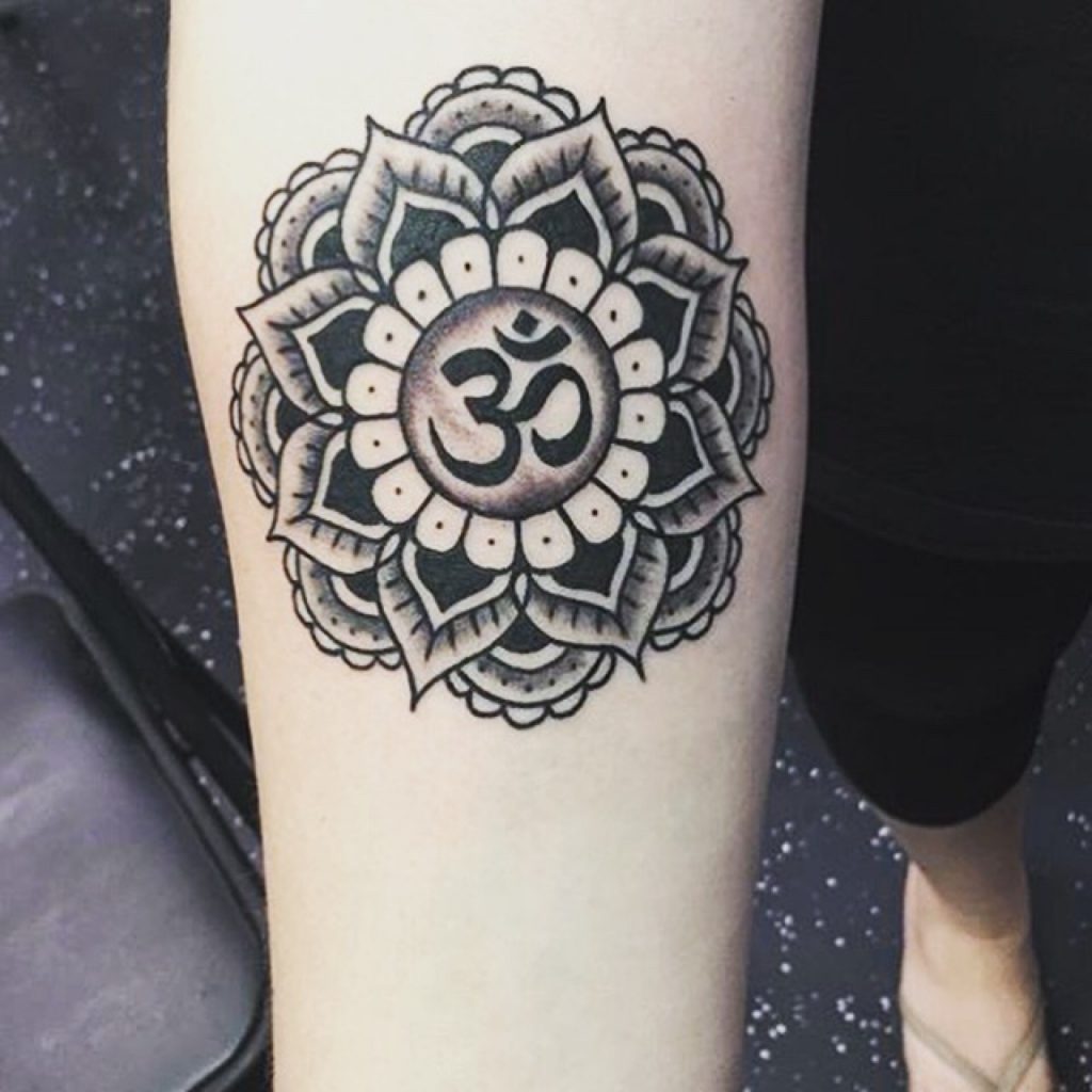 Blackwork mandala and om tattoo